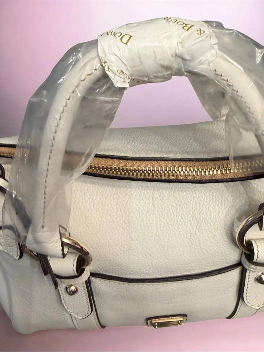 Sold.  Dooney & Bourke off white Pebble Leather Satchel with Gold Hardware NWT